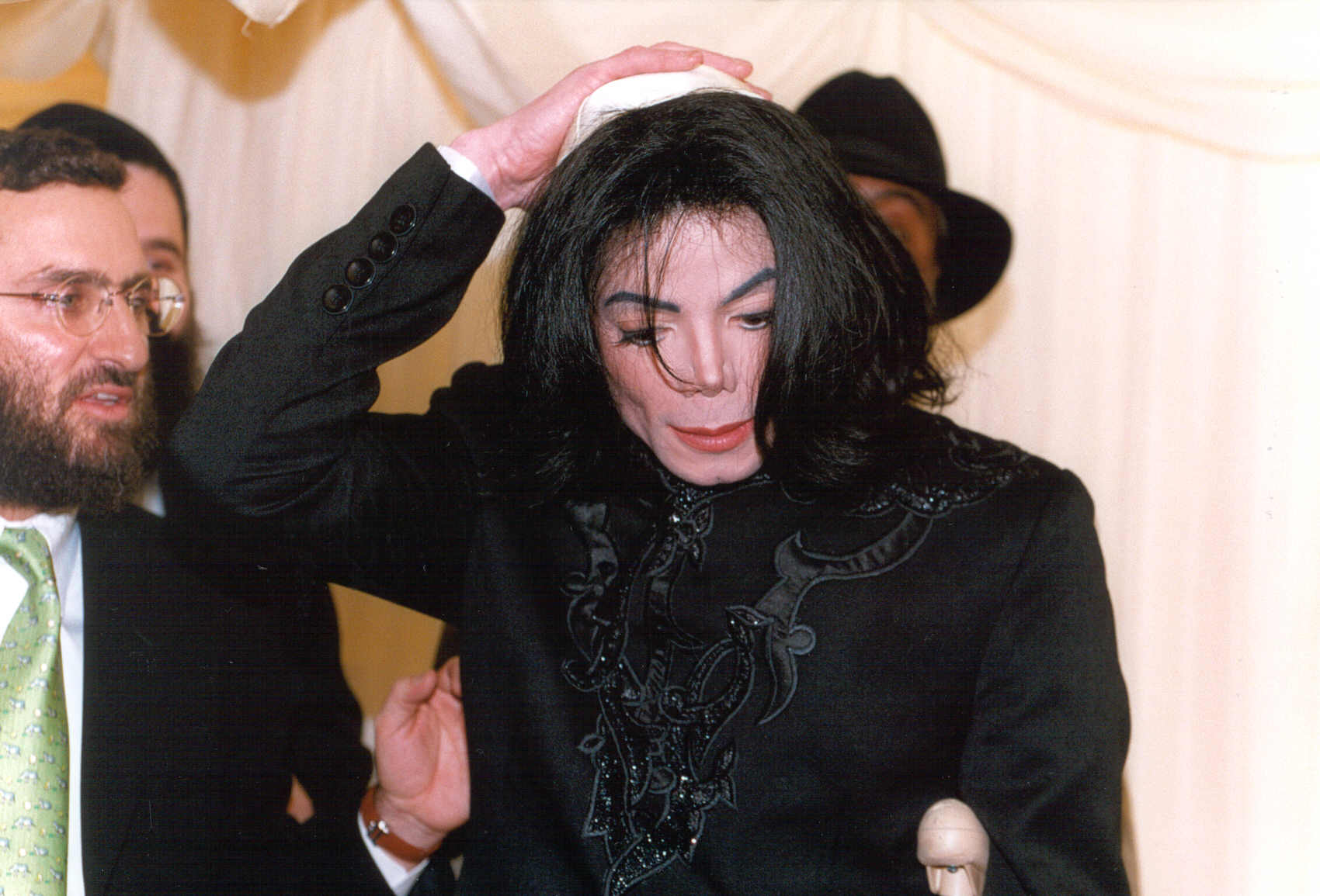 Michael Jackson should have gotten a new Rabbi! How could he not enlighten him about clips instead of using his hand as one.