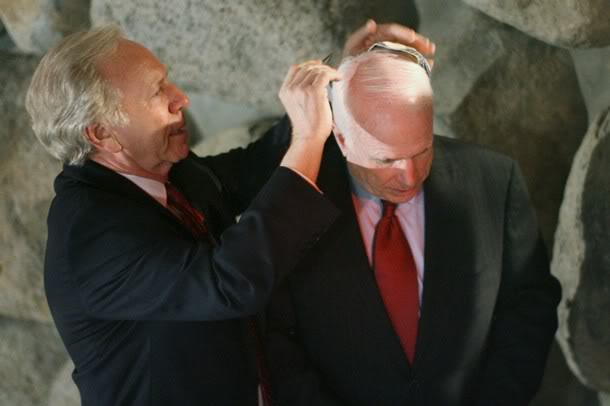 McCain couldn't have asked a better person to help him put it on correctly. With clips and all!